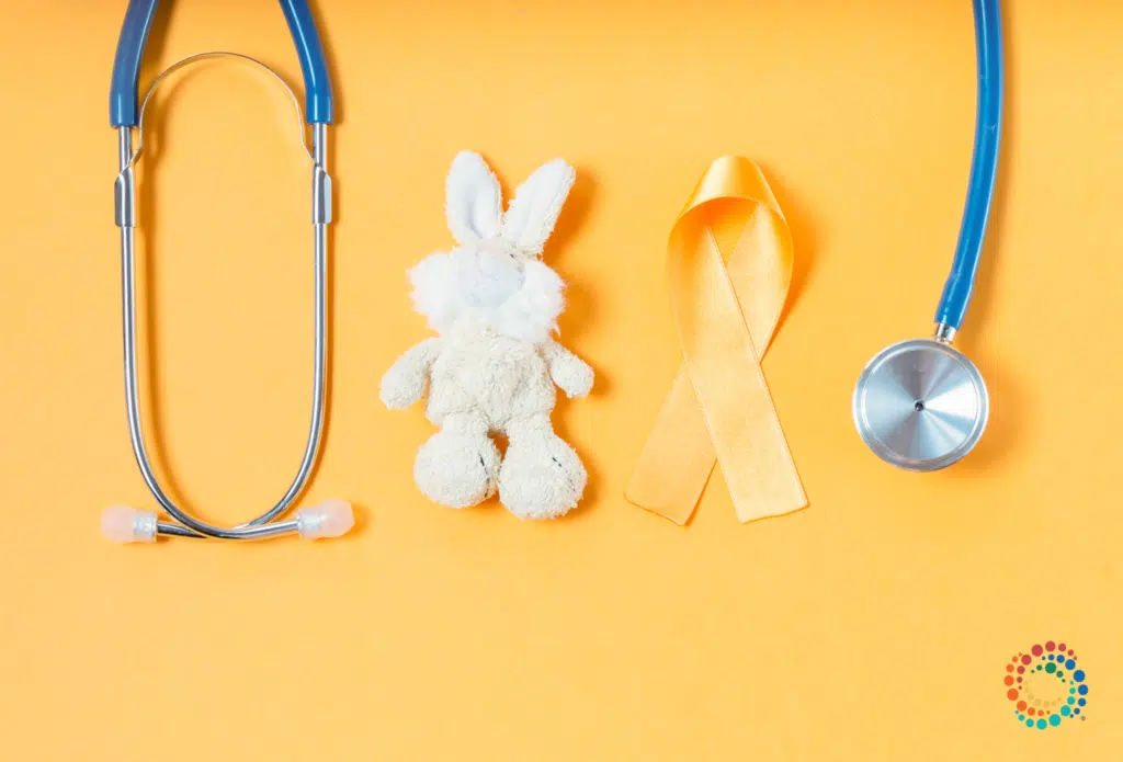 Stethoscop and plush bunny on yellow background